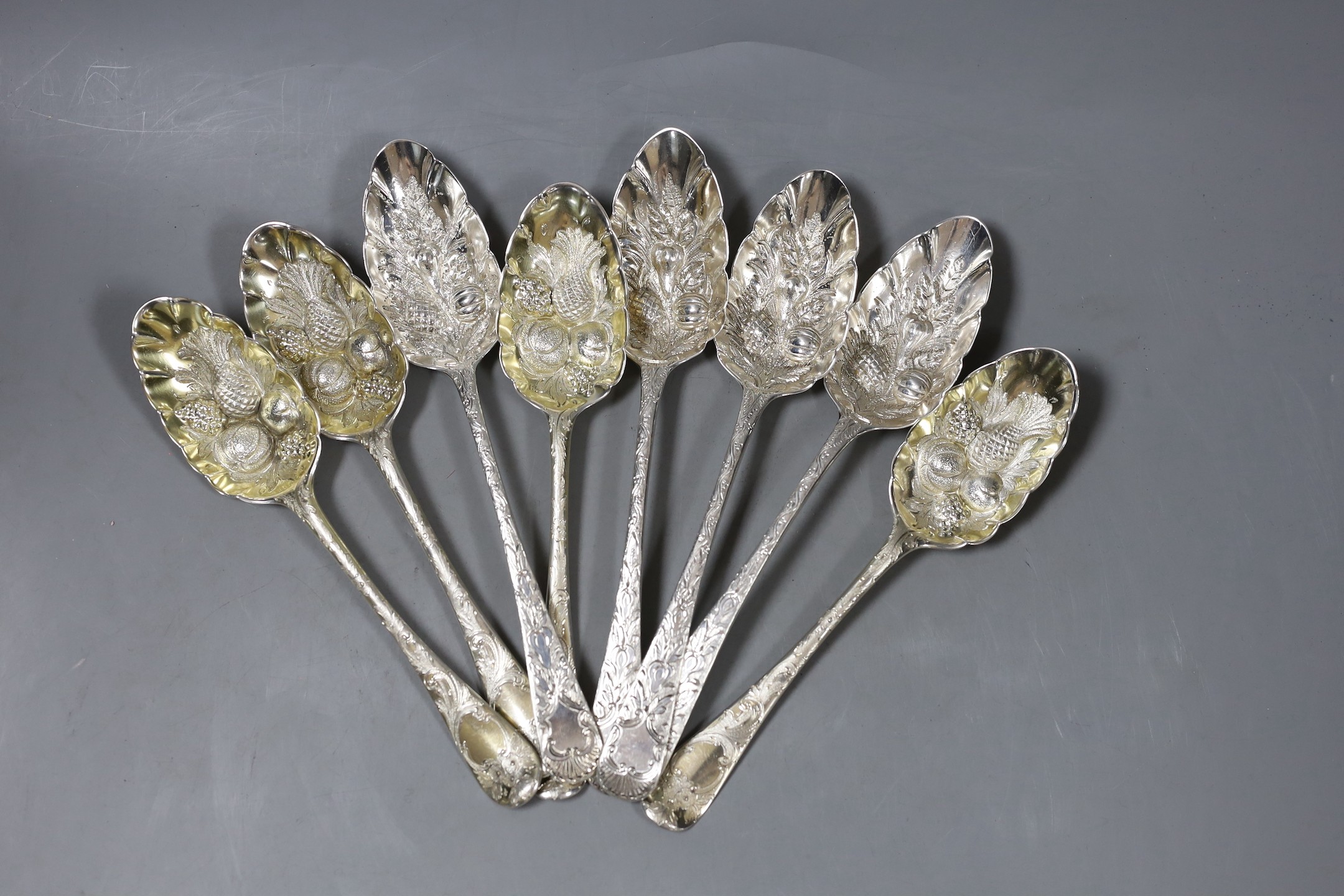 A set of four George III silver 'berry' spoons, by Eley & Fearn, London, 1805 and four earlier silver 'berry' spoons, marks pinched